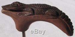 Carved wooden alligator that was made to be a handle for a walking stick
